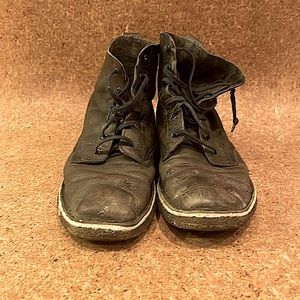 Worn and broken-in Clark’s blue leather boots